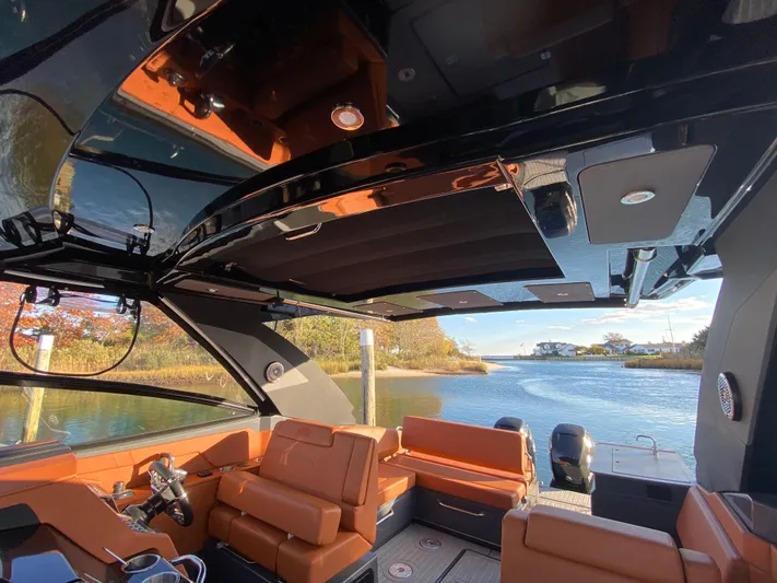  Yacht Photos Pics 2023 Cruisers Yachts 34 GLS OB interior with luxurious seating and scenic water view.