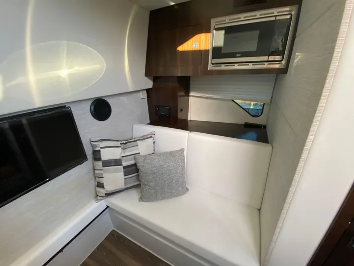  Yacht Photos Pics 2023 Cruisers Yachts 34 GLS OB interior with white seating and modern amenities.