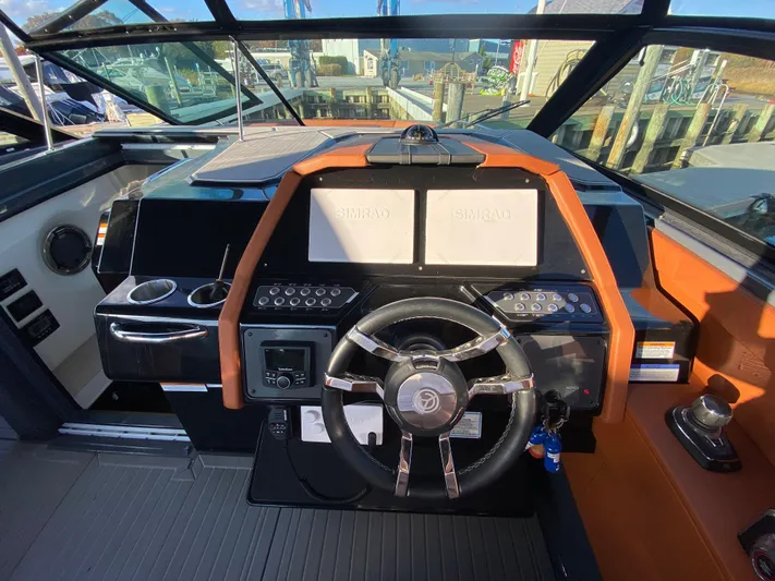  Yacht Photos Pics 2023 Cruisers Yachts 34 GLS OB helm with dual displays and modern controls.