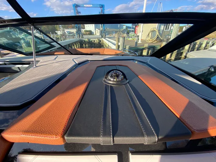  Yacht Photos Pics 2023 Cruisers Yachts 34 GLS OB dashboard with compass, docked at marina.