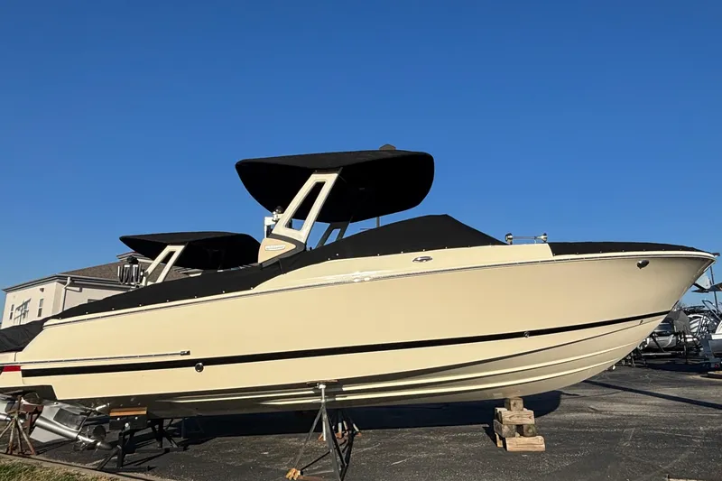  Yacht Photos Pics 2026 Chris-Craft Sportster 28 boat on display under clear blue sky.
