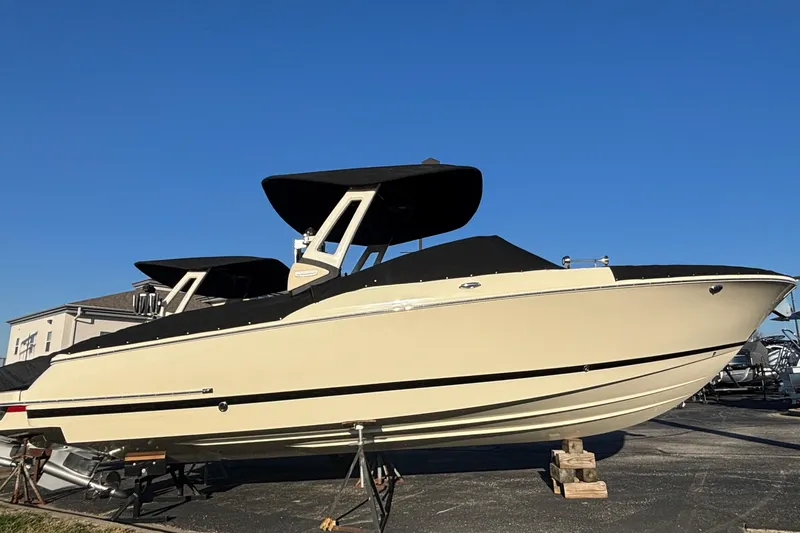 Yacht Photos Pics 2026 Chris-Craft Sportster 28 boat on display under clear blue sky.
