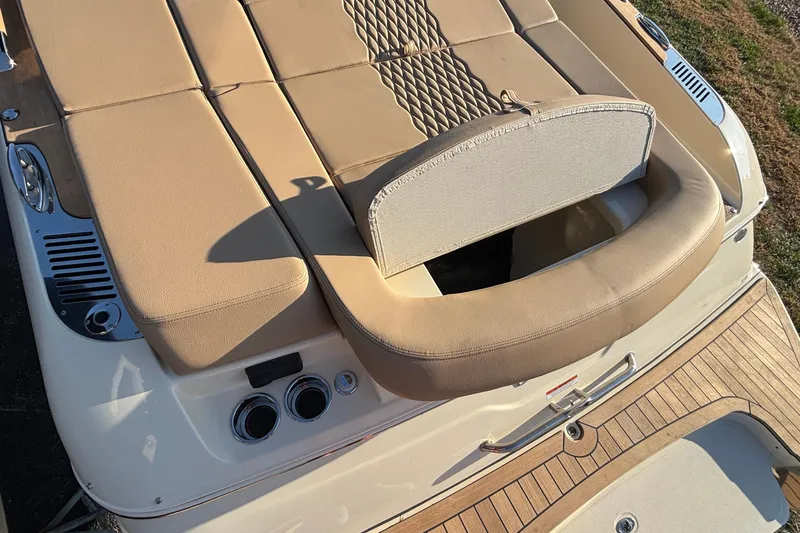  Yacht Photos Pics 2026 Chris-Craft Sportster 28 boat with beige seating and wooden deck details.