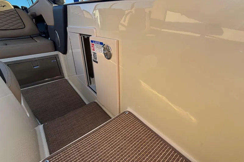  Yacht Photos Pics Interior view of 2026 Chris-Craft Sportster 28, featuring seating and storage compartments.