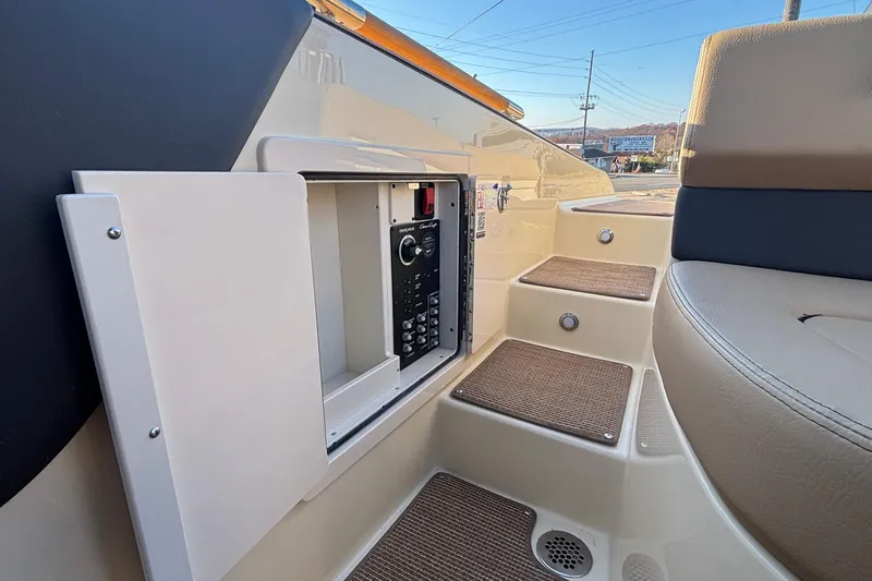  Yacht Photos Pics 2026 Chris-Craft Sportster 28 interior with control panel and seating area.