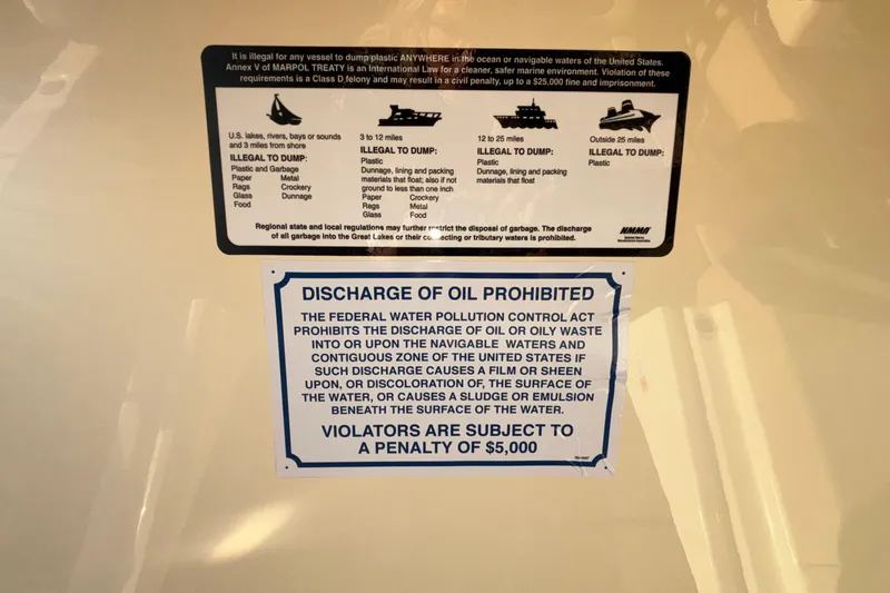  Yacht Photos Pics Warning labels on Chris-Craft Sportster 28, 2026 model, prohibiting waste discharge in U.S. waters.