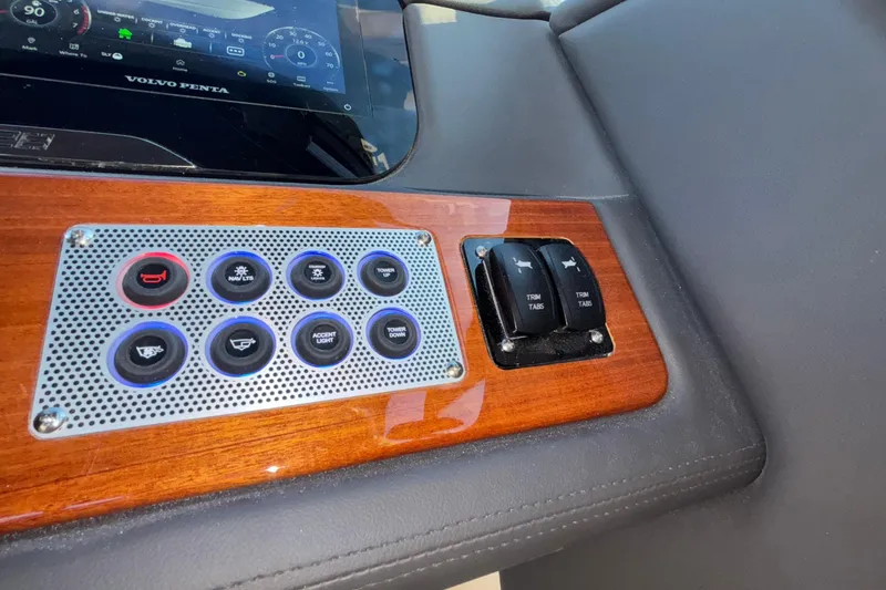  Yacht Photos Pics Dashboard controls of 2026 Chris-Craft Sportster 28 with Volvo Penta display and trim tab switches.