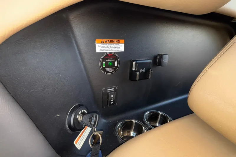  Yacht Photos Pics 2026 Chris-Craft Sportster 28 dashboard with ignition, warning label, and cup holders.