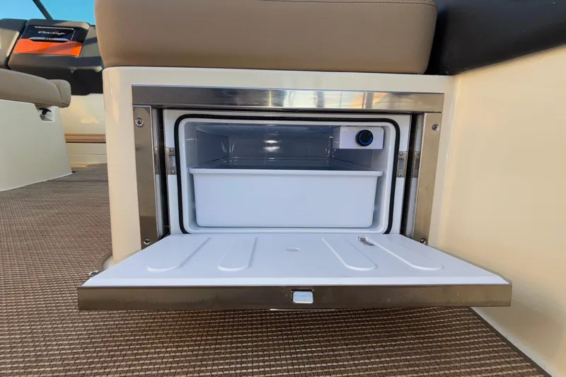  Yacht Photos Pics 2026 Chris-Craft Sportster 28 boat interior with open storage compartment.