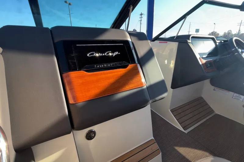  Yacht Photos Pics 2026 Chris-Craft Sportster 28 interior with sleek dashboard and wood accents.