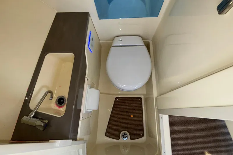  Yacht Photos Pics 2026 Chris-Craft Sportster 28 boat bathroom with sink and toilet.