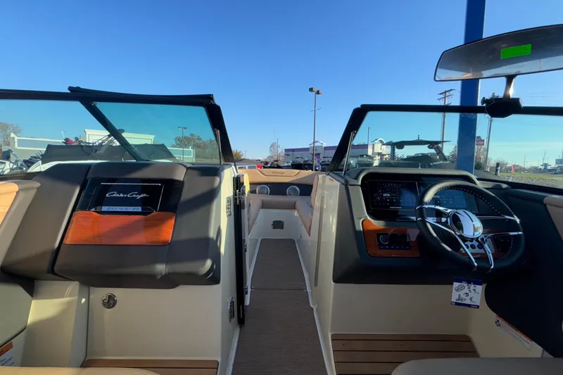  Yacht Photos Pics 2026 Chris-Craft Sportster 28 boat interior with modern dashboard and steering wheel.