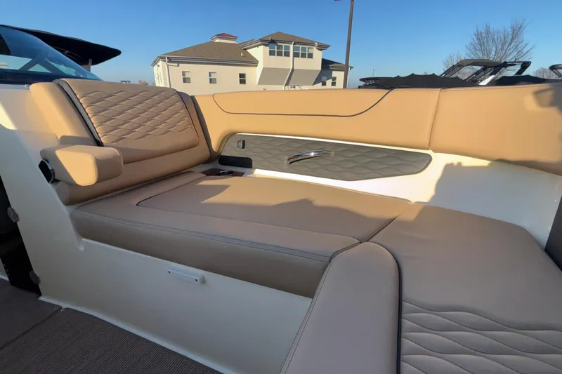  Yacht Photos Pics 2026 Chris-Craft Sportster 28 interior with tan leather seating and quilted design.