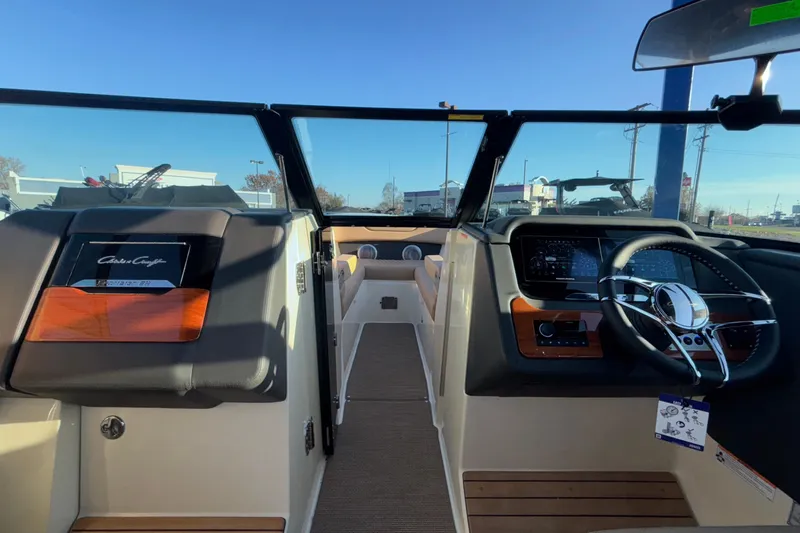  Yacht Photos Pics 2026 Chris-Craft Sportster 28 boat interior with modern dashboard and steering wheel.