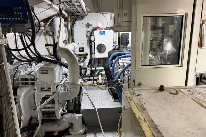  Yacht Photos Pics Engine room of a 1990 Heesen 144 yacht, showcasing machinery and control systems.