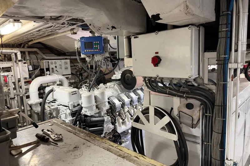  Yacht Photos Pics Engine room of a 1990 Heesen 144 yacht, featuring machinery and control panels.