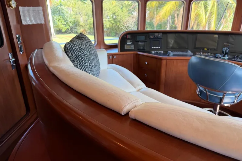  Yacht Photos Pics Luxurious interior of 1990 Heesen 144 yacht with plush seating and control panel.