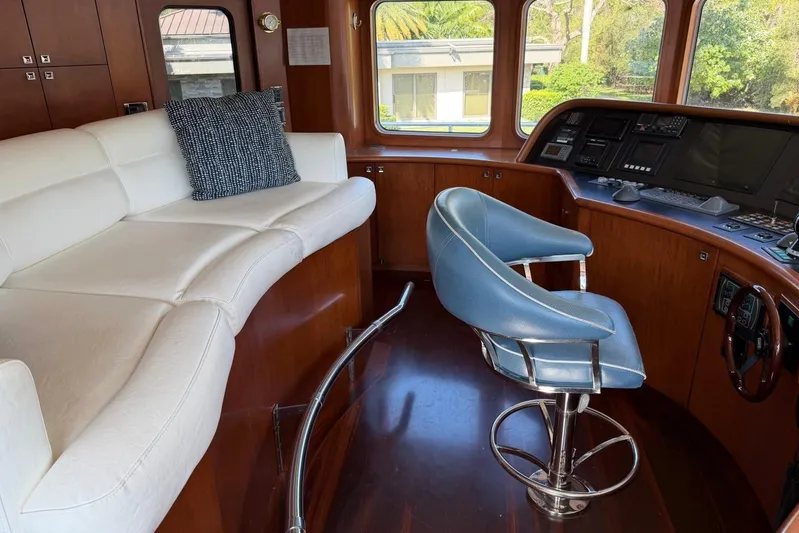  Yacht Photos Pics Luxurious Heesen 144 yacht interior with white sofa, blue chair, and control panel, 1990 model.