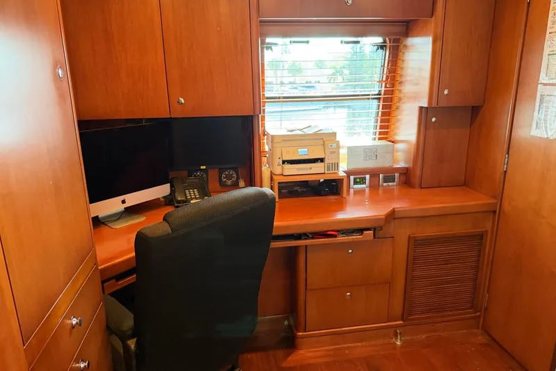  Yacht Photos Pics Luxurious wooden office interior on a 1990 Heesen 144 yacht with desk and equipment.
