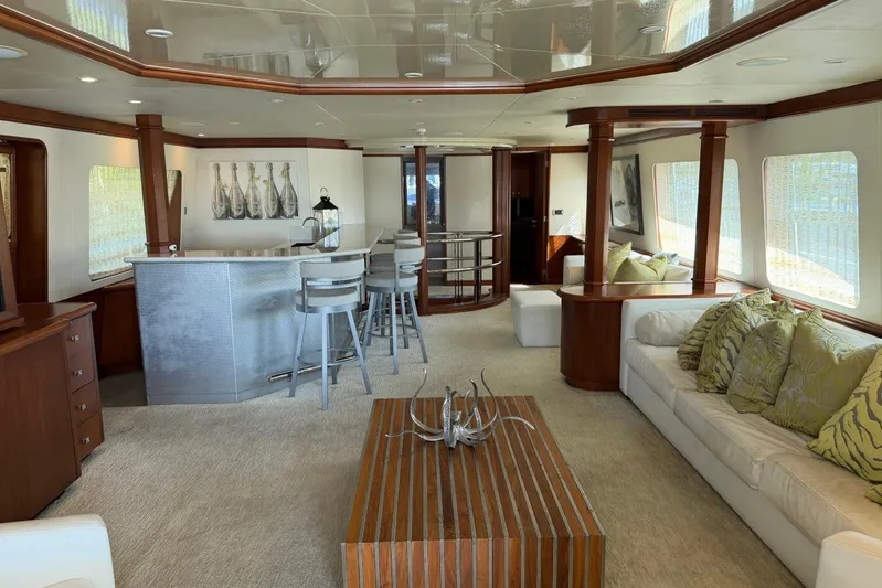  Yacht Photos Pics Luxurious interior of 1990 Heesen 144 yacht with elegant bar and seating area.