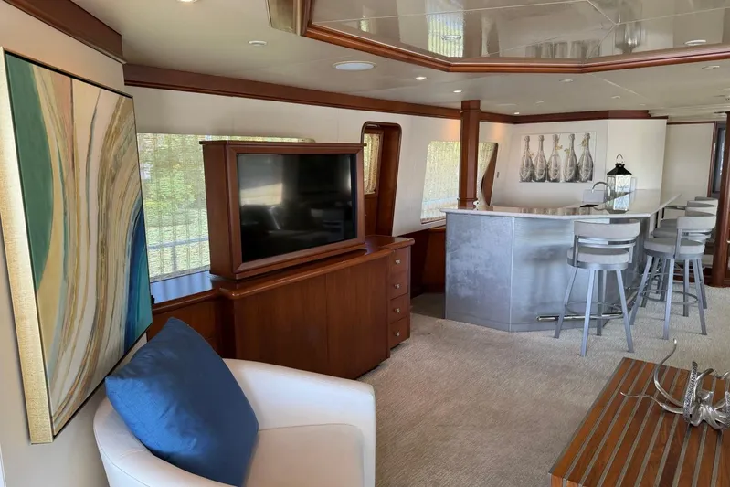  Yacht Photos Pics Luxurious interior of 1990 Heesen 144 yacht with modern bar and elegant decor.