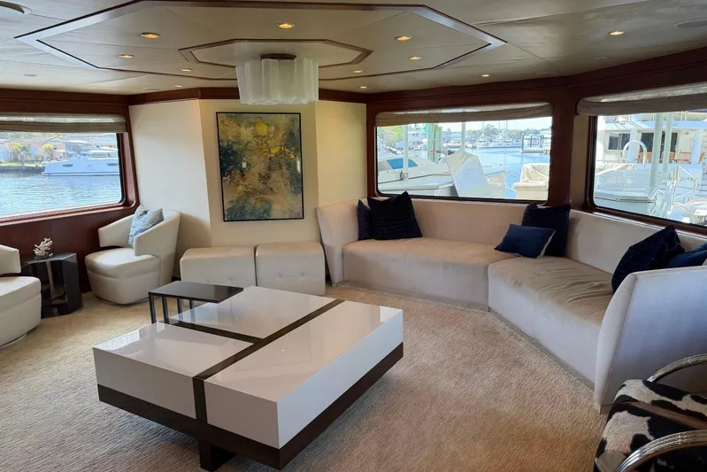  Yacht Photos Pics Luxurious yacht interior with modern decor, large windows, and elegant seating on a 1990 Heesen 144.