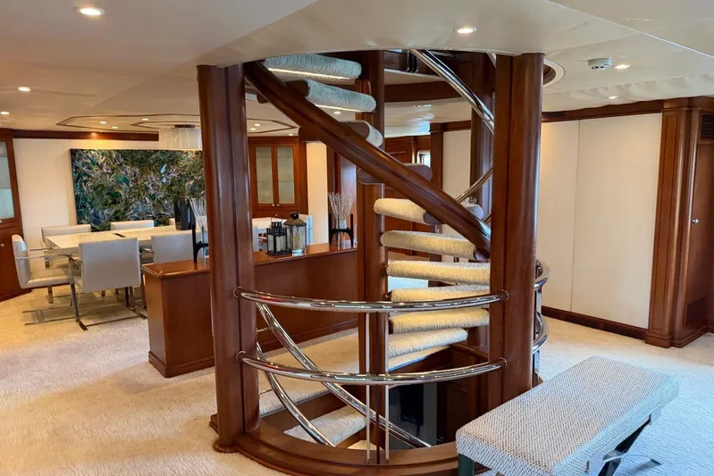  Yacht Photos Pics Luxurious Heesen 144 yacht interior with elegant spiral staircase and modern dining area, 1990 model.