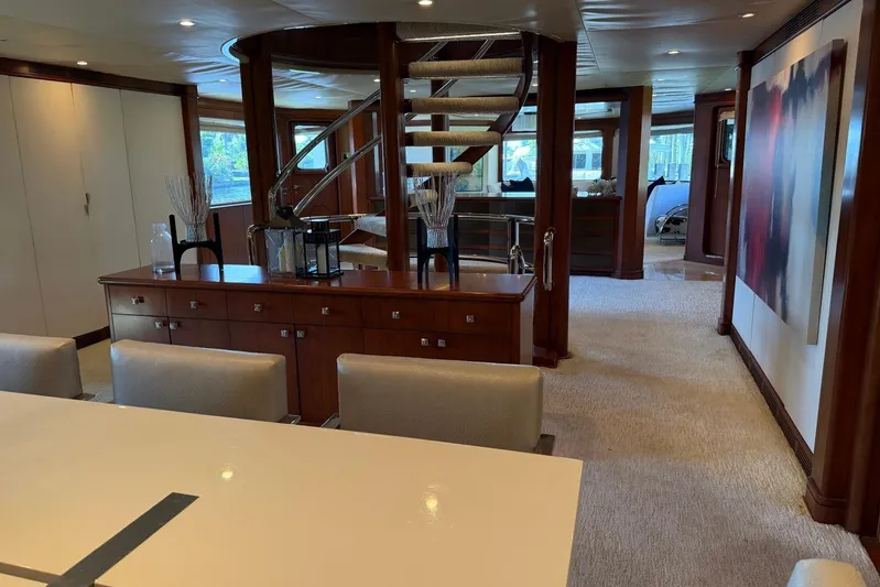  Yacht Photos Pics Luxurious interior of 1990 Heesen 144 yacht with elegant staircase and modern decor.