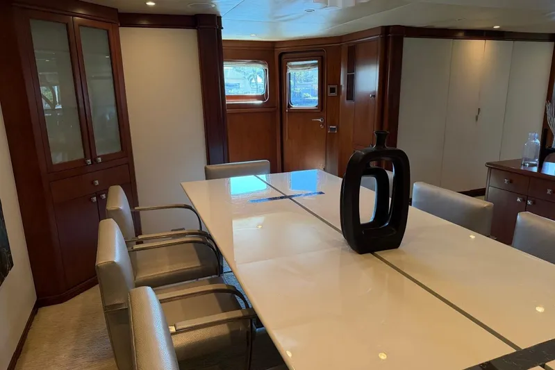  Yacht Photos Pics Luxurious dining area on a 1990 Heesen 144 yacht with elegant decor.