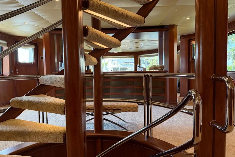  Yacht Photos Pics Luxurious interior of 1990 Heesen 144 yacht with elegant spiral staircase.