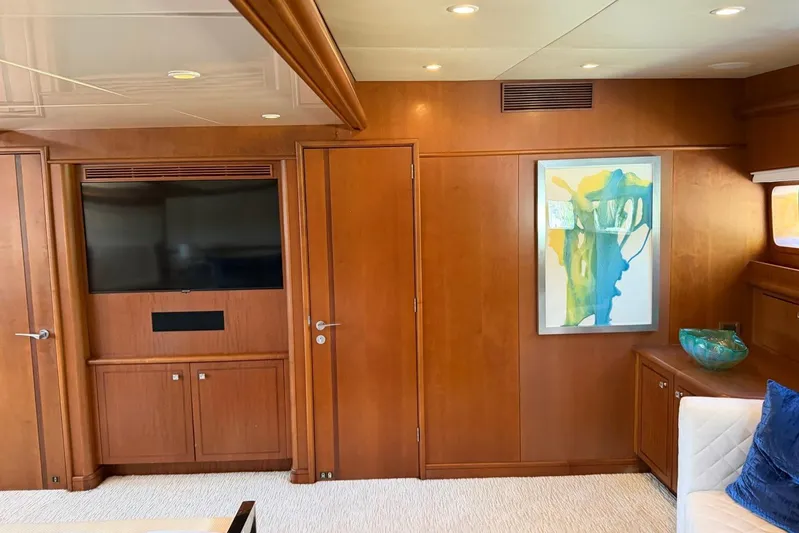  Yacht Photos Pics Luxurious Heesen 144 yacht interior with wood paneling, TV, and abstract art, 1990 model.