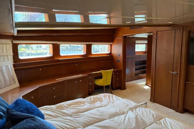  Yacht Photos Pics Luxurious Heesen 144 yacht interior, featuring elegant wood paneling and a cozy bedroom, built in 1990.
