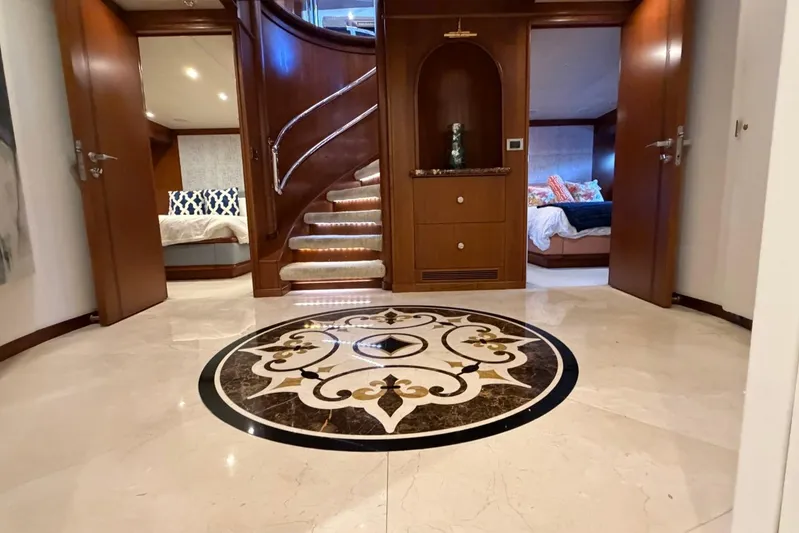 Yacht Photos Pics Luxurious interior of 1990 Heesen 144 yacht with elegant marble flooring and wooden accents.