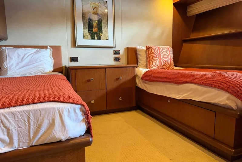  Yacht Photos Pics Twin cabin with orange decor on a 1990 Heesen 144 yacht.
