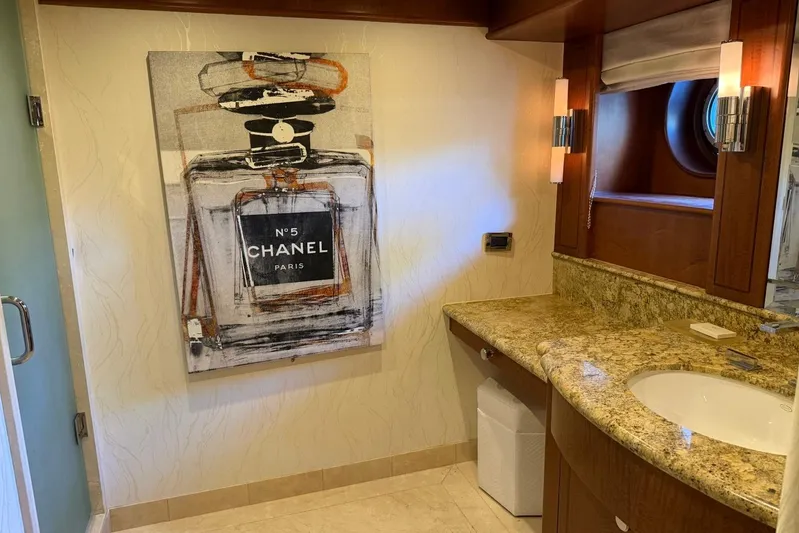  Yacht Photos Pics Luxurious yacht bathroom with Chanel artwork, granite countertop, and elegant lighting. Heesen 144, 1990.