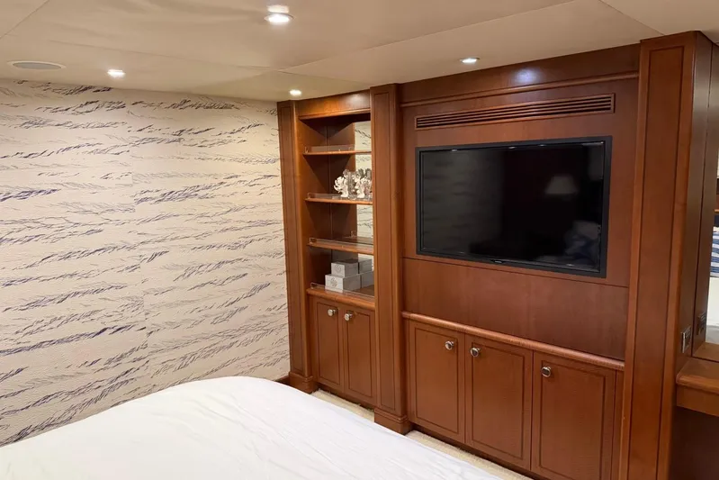  Yacht Photos Pics Luxurious Heesen 144 yacht interior with wood paneling and built-in TV, 1990 model.