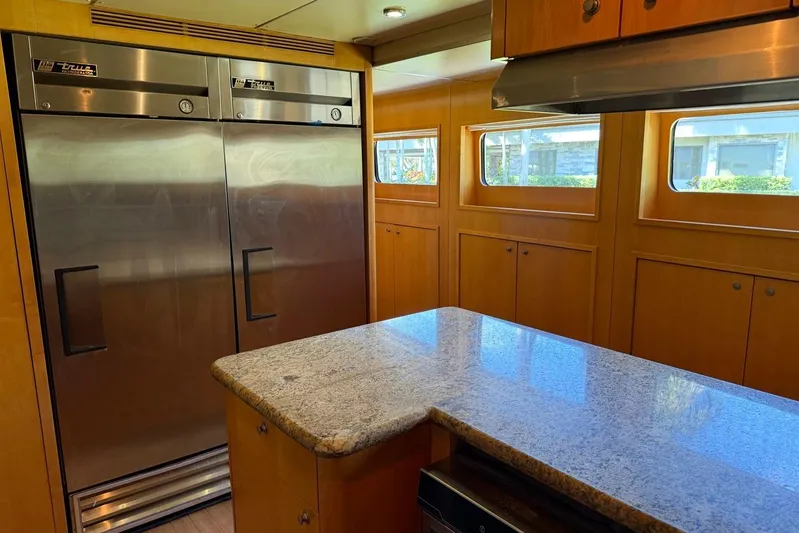  Yacht Photos Pics Luxurious kitchen interior on 1990 Heesen 144 yacht with stainless steel appliances.