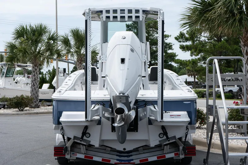  Yacht Photos Pics 2026 Blackfin 262 HB boat on trailer, rear view, with palm trees in background.