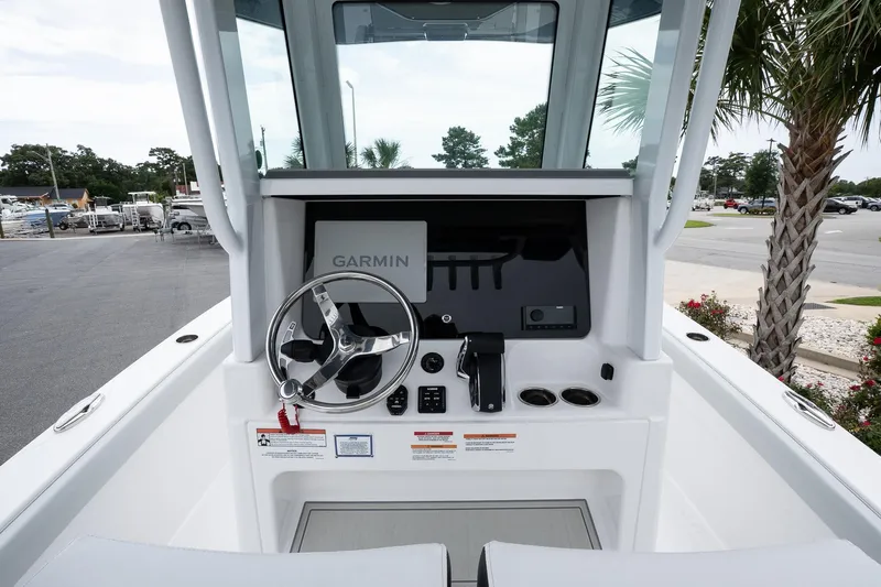  Yacht Photos Pics 2026 Blackfin 262 HB boat helm with Garmin navigation system and steering wheel.