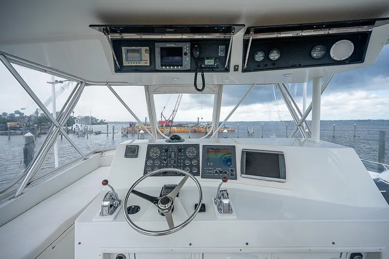  Yacht Photos Pics 1998 Viking 47 Convertible yacht helm with navigation equipment and ocean view.