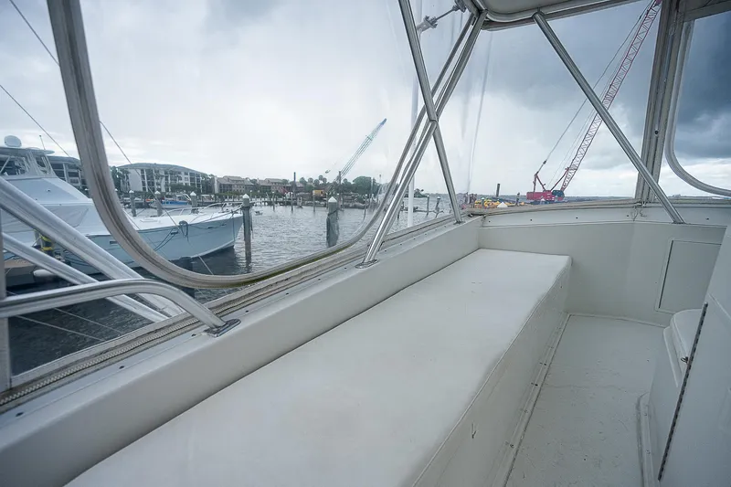  Yacht Photos Pics 1998 Viking 47 Convertible boat interior with marina view through windows.