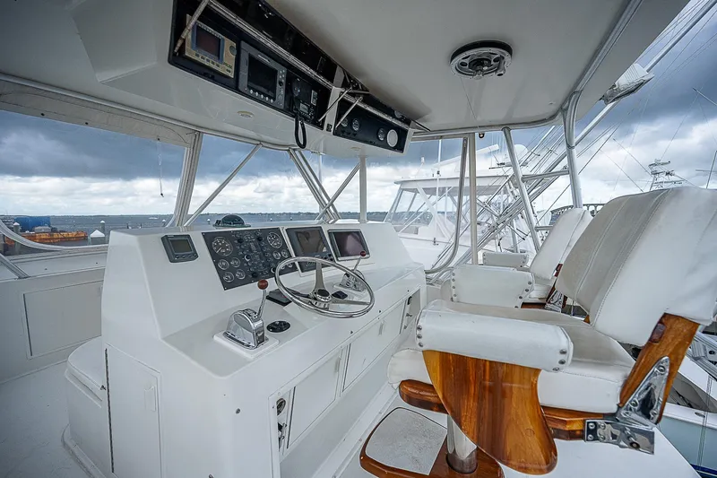  Yacht Photos Pics Helm of 1998 Viking 47 Convertible yacht with modern controls and ocean view.