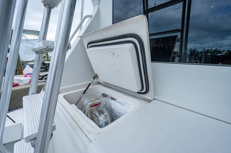  Yacht Photos Pics Open storage compartment on 1998 Viking 47 Convertible yacht deck.