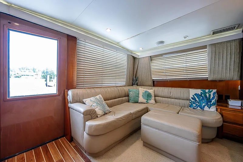  Yacht Photos Pics Luxurious interior of 1998 Viking 47 Convertible yacht with plush seating and elegant decor.