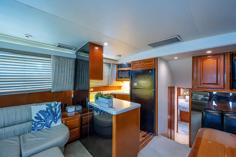  Yacht Photos Pics Interior of 1998 Viking 47 Convertible yacht with modern kitchen and cozy seating area.