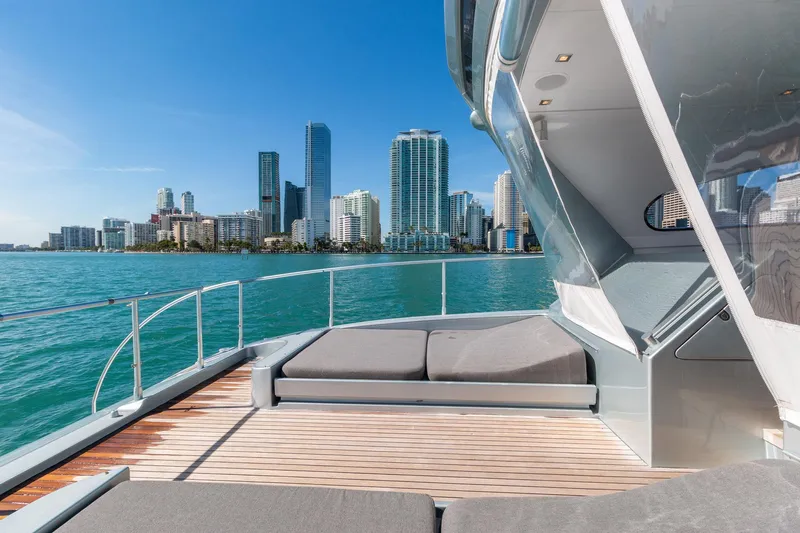 Happy One Yacht Photos Pics Luxurious 2007 Leopard Express Motor Yacht with city skyline view on a sunny day.