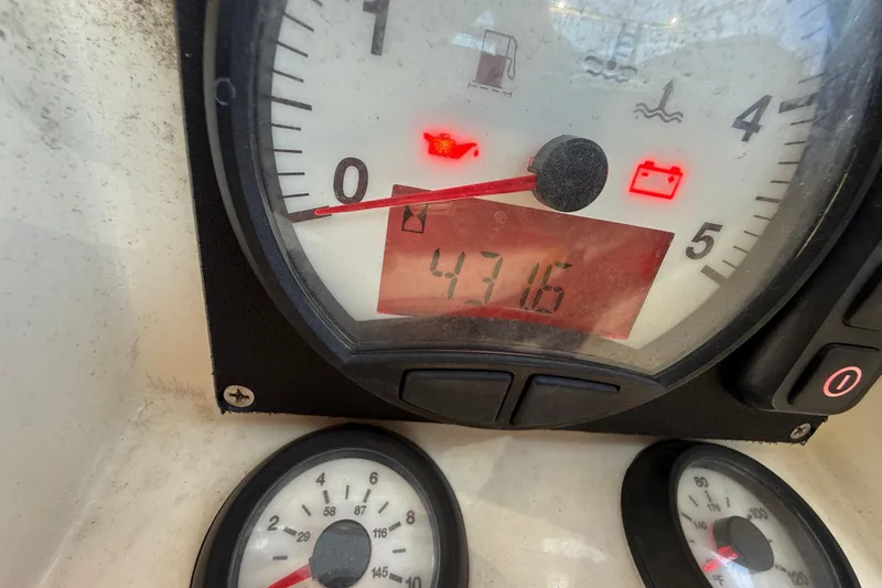 Magic Maddie 2 Yacht Photos Pics Close-up of Beneteau Oceanis 43 2010 boat dashboard with gauges and warning lights.