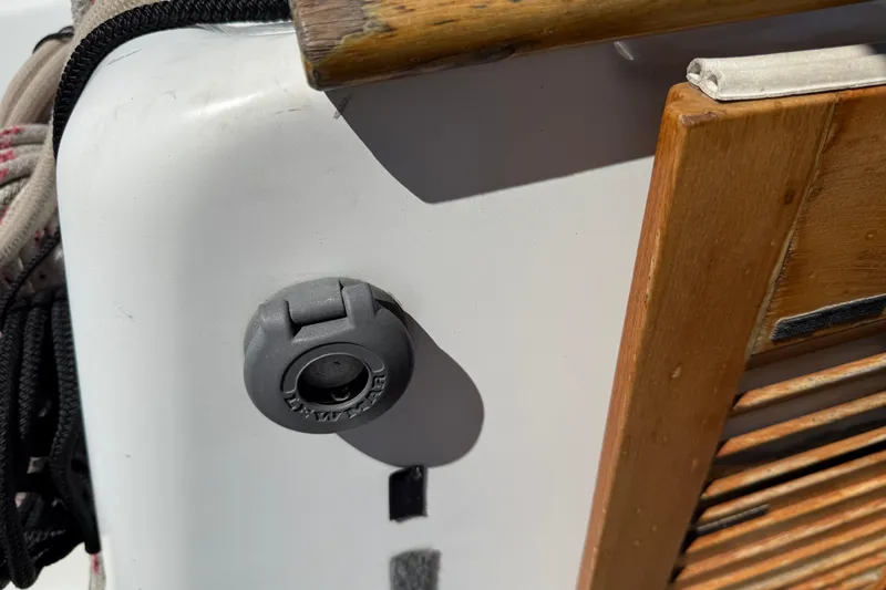 Magic Maddie 2 Yacht Photos Pics Close-up of a 2010 Beneteau Oceanis 43 boat detail, featuring wood and a plug socket.