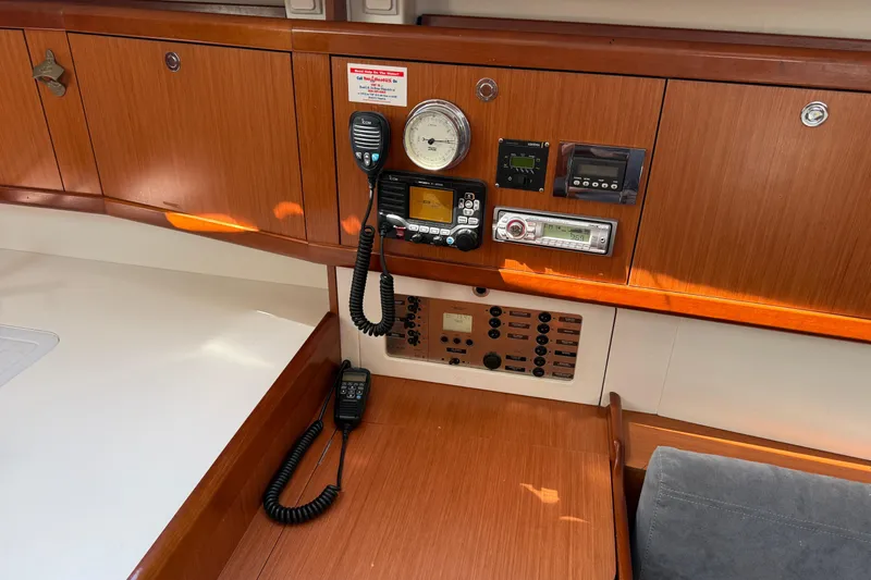 Magic Maddie 2 Yacht Photos Pics Interior control panel of a 2010 Beneteau Oceanis 43 sailboat with navigation equipment.