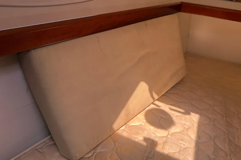 Magic Maddie 2 Yacht Photos Pics Interior cabin of 2010 Beneteau Oceanis 43 yacht with beige cushions.